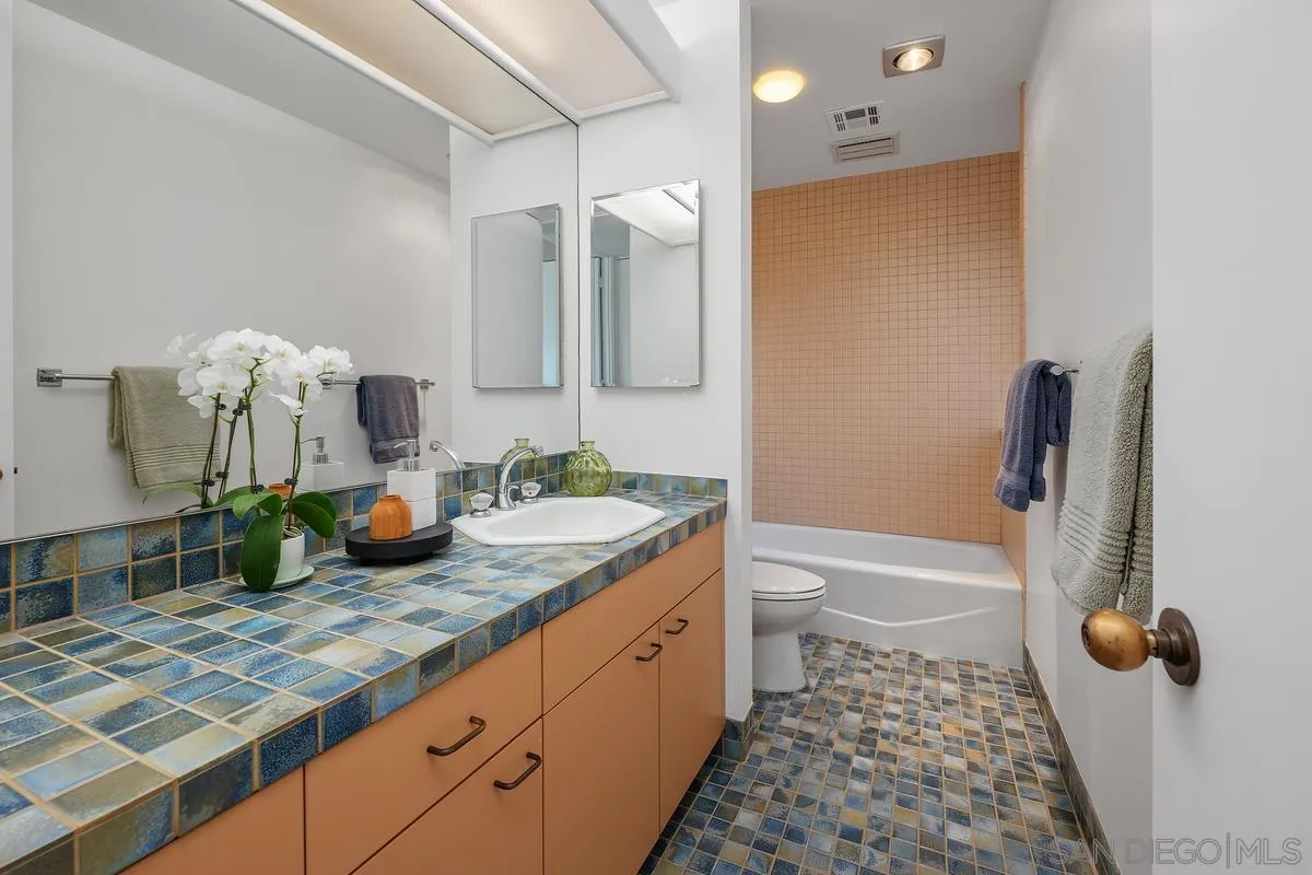 14430 Rancho Santa Fe Farms Road Rancho Santa Fe, CA 92067 - Photo 27 of 51 a bathroom with a granite countertop sink mirror vanity and toilet