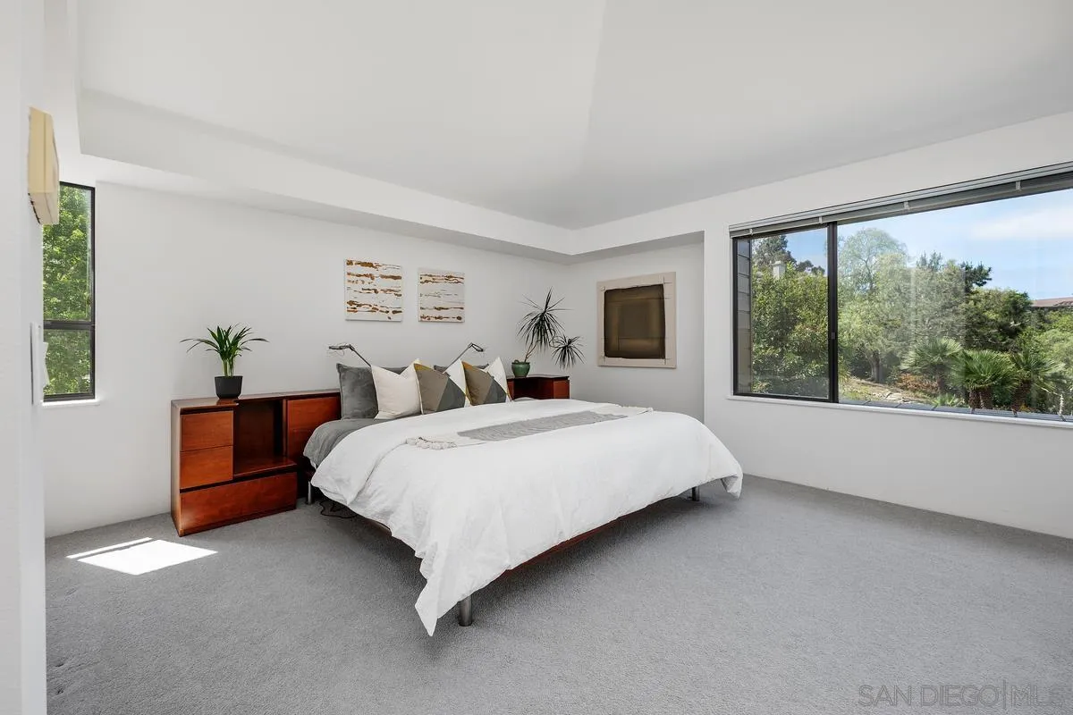 14430 Rancho Santa Fe Farms Road Rancho Santa Fe, CA 92067 - Photo 31 of 51 a bed sitting in a spacious bedroom next to a window