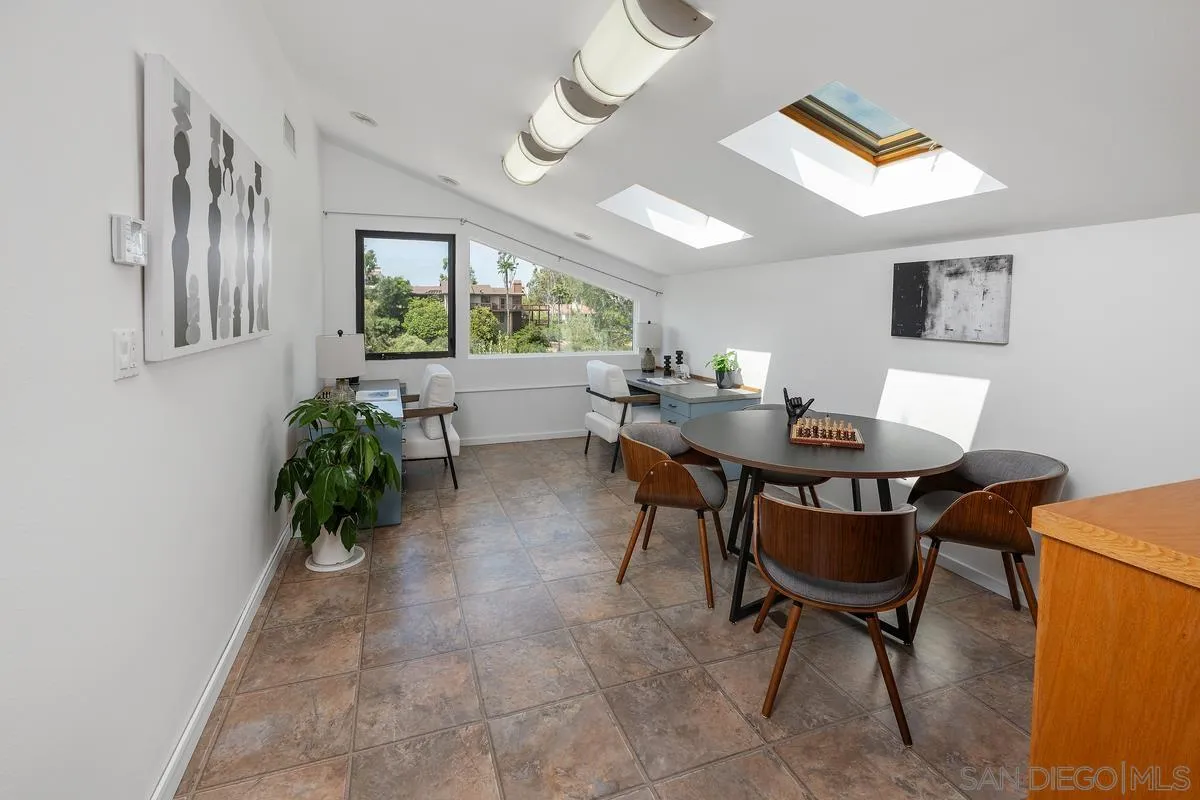 14430 Rancho Santa Fe Farms Road Rancho Santa Fe, CA 92067 - Photo 41 of 51 a view of a dining room with furniture and a potted plant