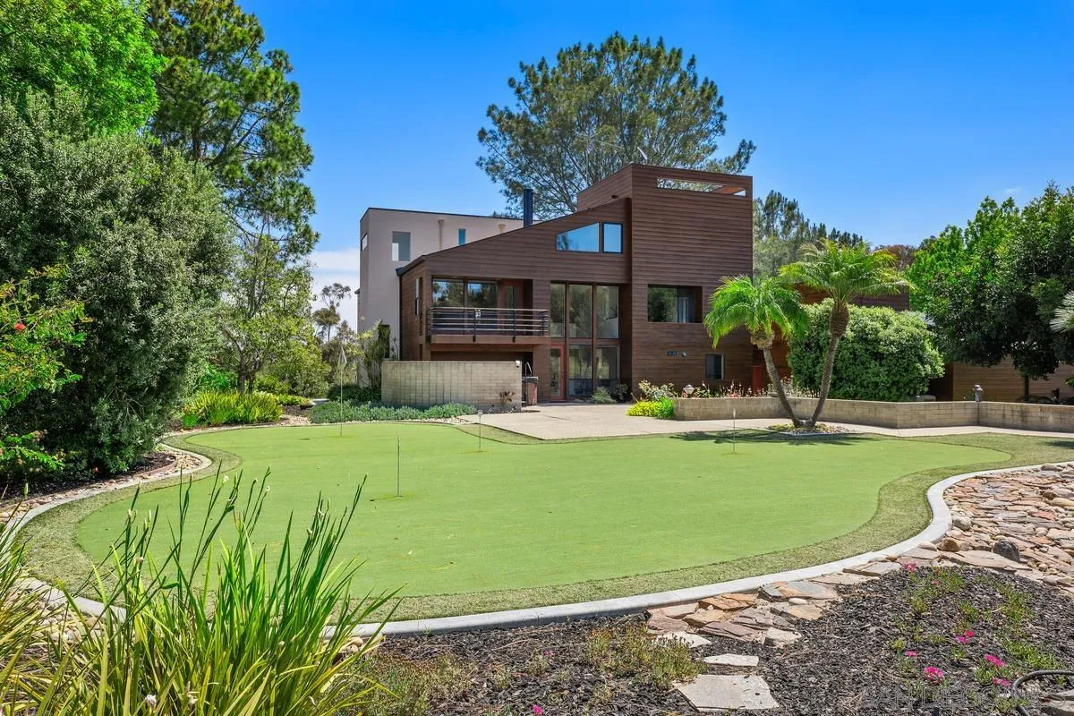 14430 Rancho Santa Fe Farms Road Rancho Santa Fe, CA 92067 - Photo 49 of 51 a front view of a house with garden