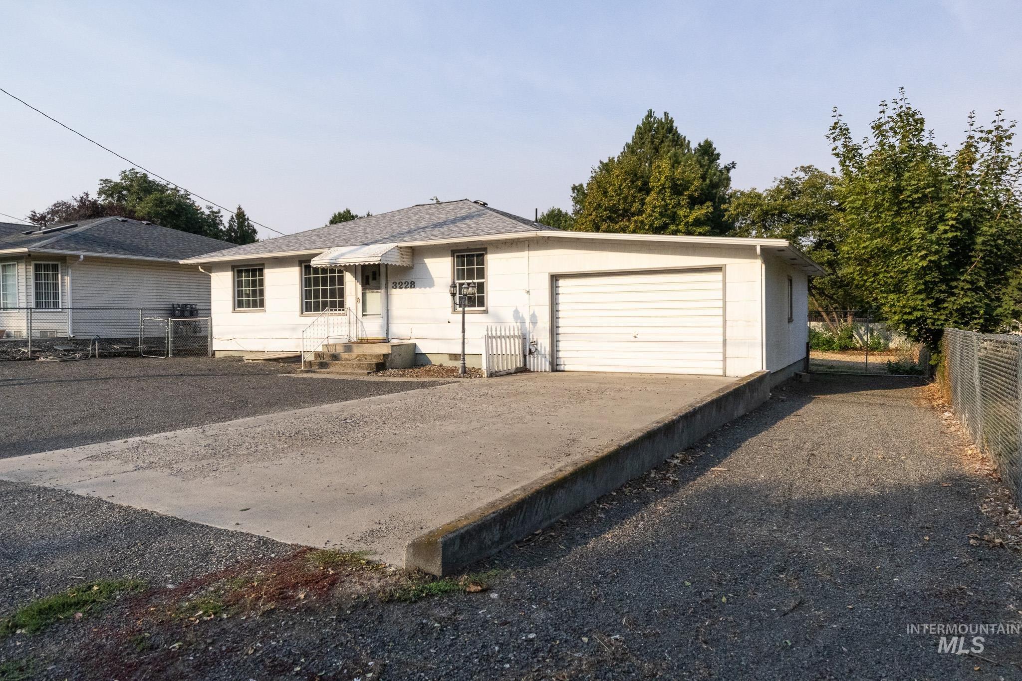 3228 5th Street Lewiston, ID 83501 - Photo 2 of 24 View of front of property with an attached garage and driveway
