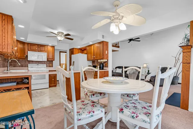 a very nice looking dining room with a table and chairs