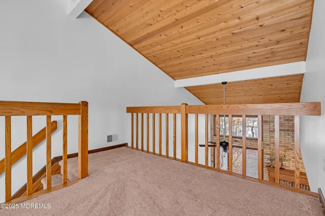 a view of a hallway with stairs