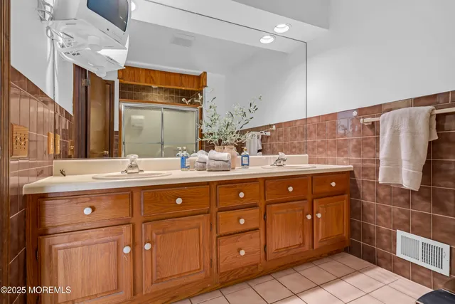 a view of front door with wooden floor and stairs