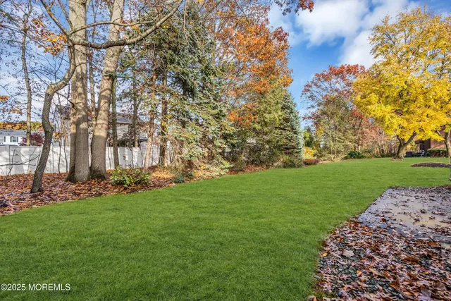 a view of a house with a yard and garage