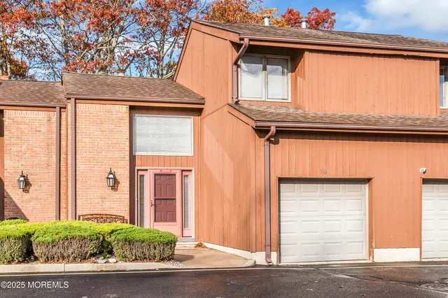 a view of a house with a door and a window