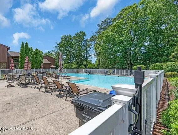 a view of a swimming pool with a patio
