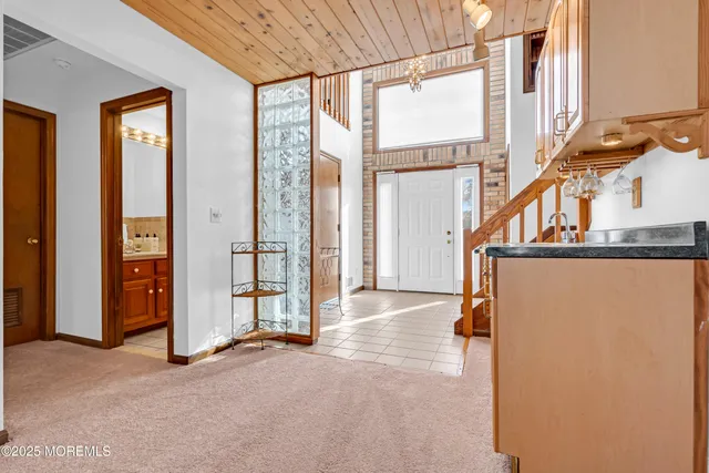 an entryway with an entryway and livingroom view