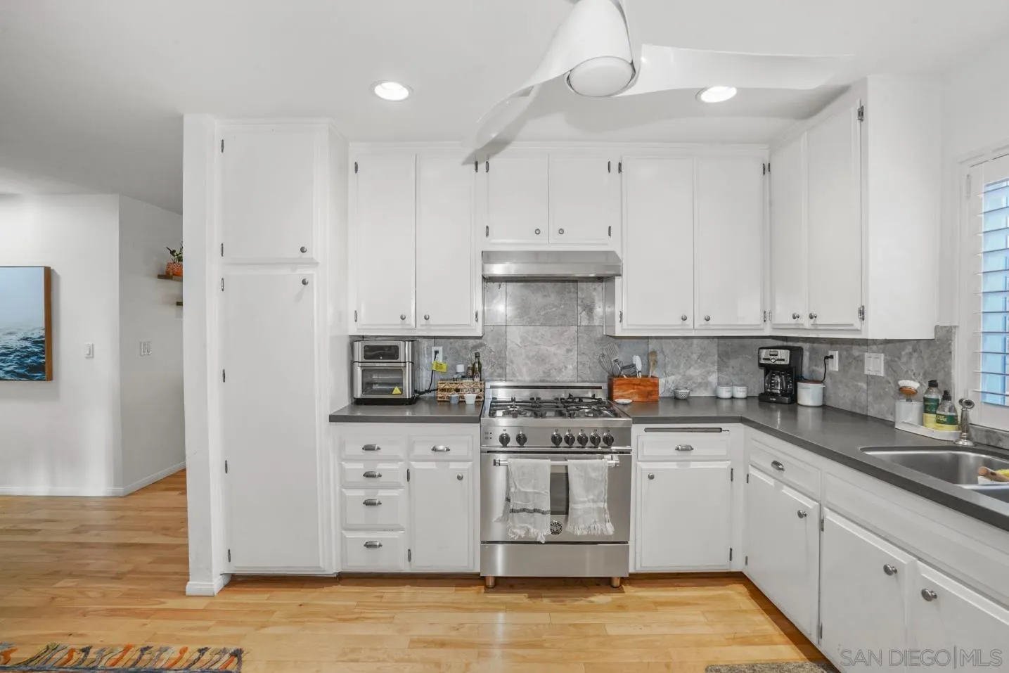 1161 Balour Drive Encinitas, CA 92024 - Photo 12 of 48 a kitchen with stainless steel appliances granite countertop a sink a stove and a refrigerator