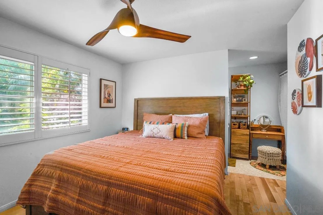 1161 Balour Drive Encinitas, CA 92024 - Photo 18 of 48 a bedroom with a bed and a lamp with window