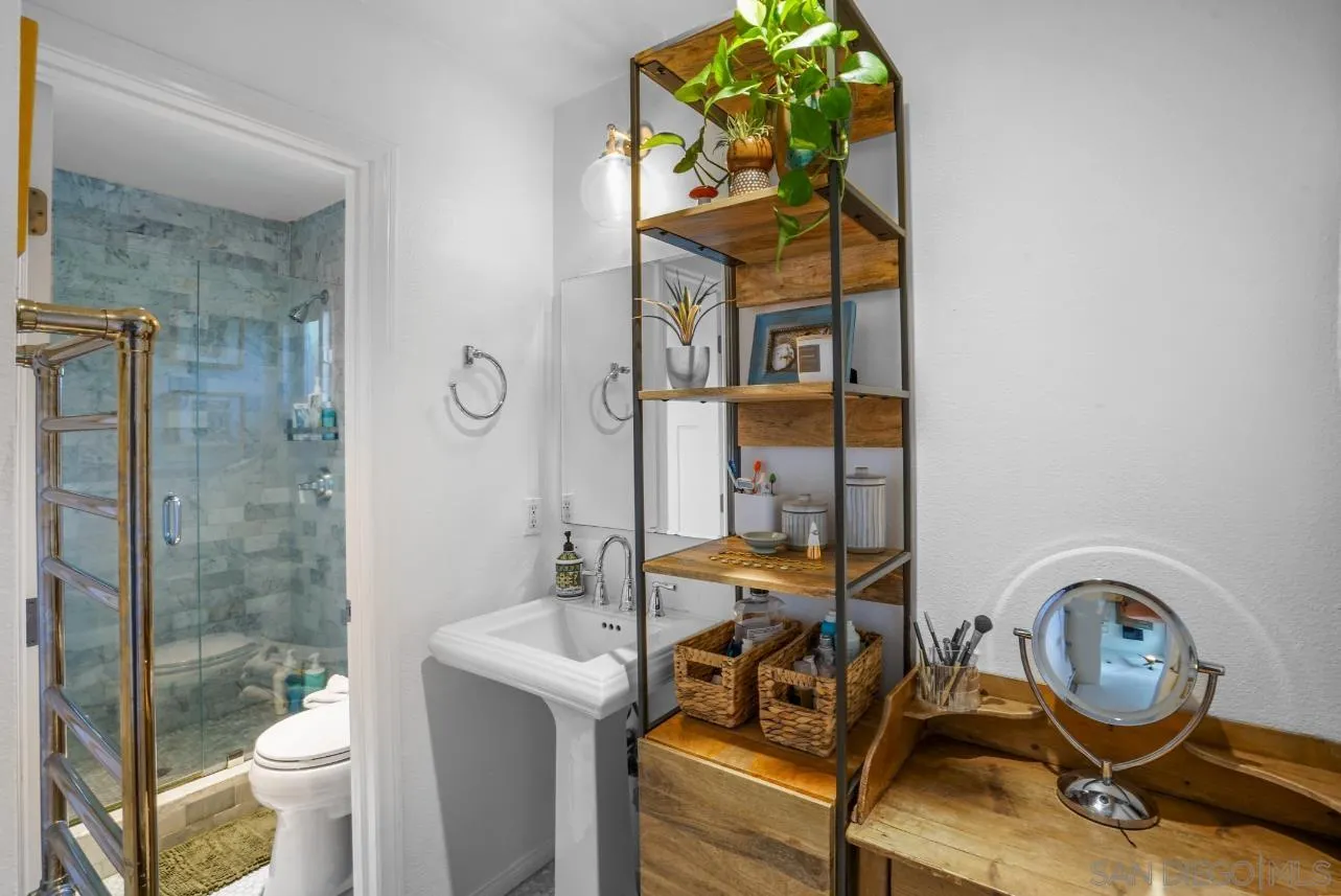 1161 Balour Drive Encinitas, CA 92024 - Photo 21 of 48 a bathroom with a sink and a mirror