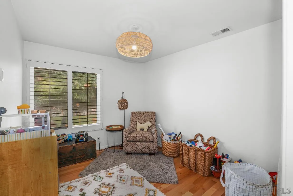 1161 Balour Drive Encinitas, CA 92024 - Photo 22 of 48 a living room with furniture and a large window