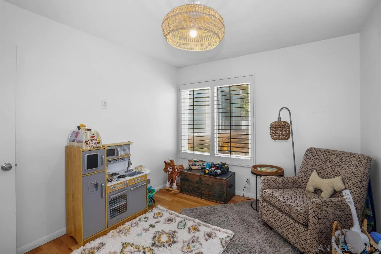 1161 Balour Drive Encinitas, CA 92024 - Photo 23 of 48 a bedroom with furniture and a window