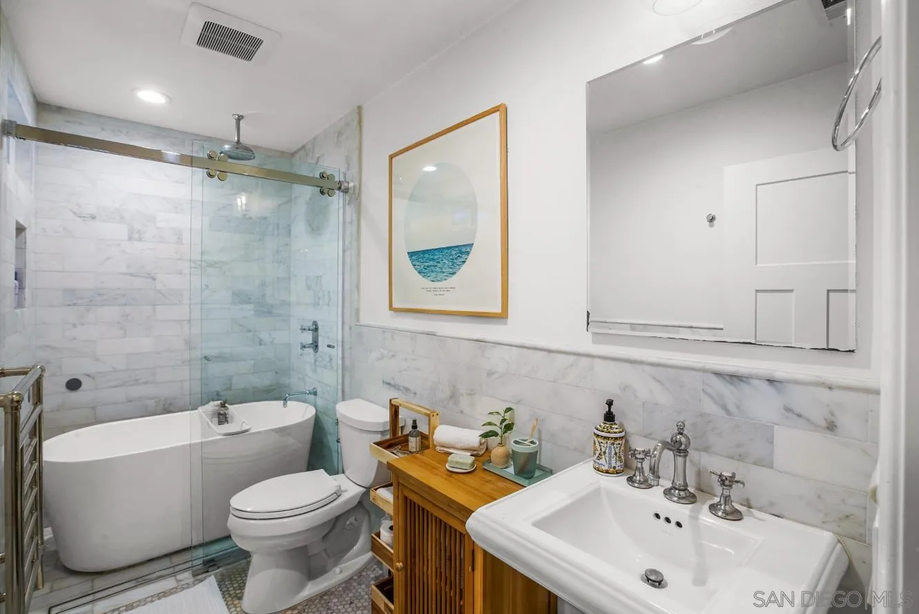 1161 Balour Drive Encinitas, CA 92024 - Photo 28 of 48 a bathroom with a toilet a sink and bathtub