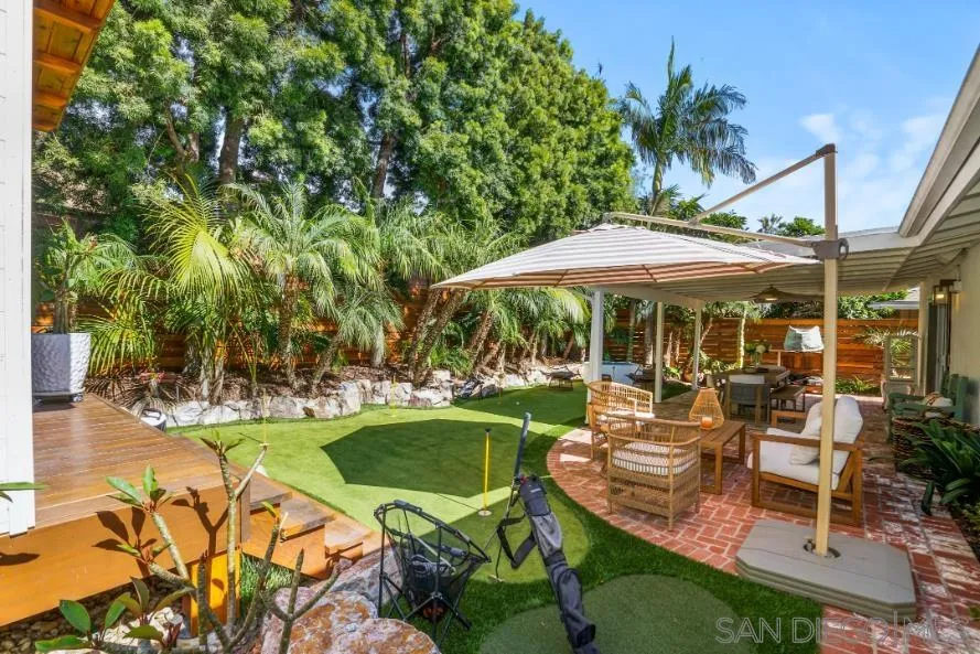 1161 Balour Drive Encinitas, CA 92024 - Photo 29 of 48 a view of a swimming pool with chairs in patio