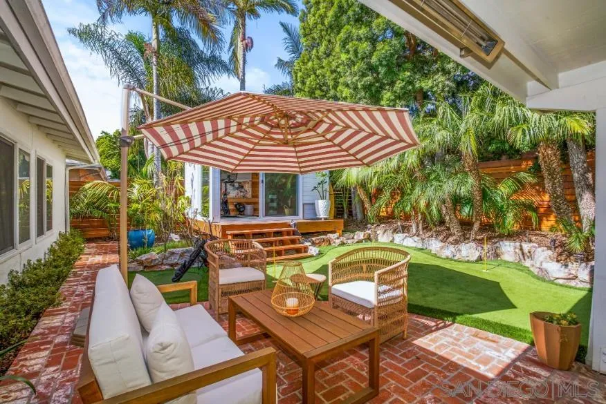 1161 Balour Drive Encinitas, CA 92024 - Photo 36 of 48 a view of a patio with table and chairs potted plants and large tree
