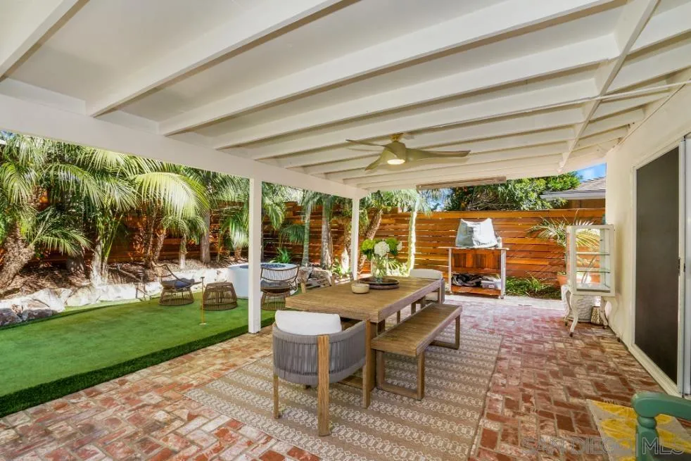 1161 Balour Drive Encinitas, CA 92024 - Photo 37 of 48 a view of a patio with a dining table and chairs