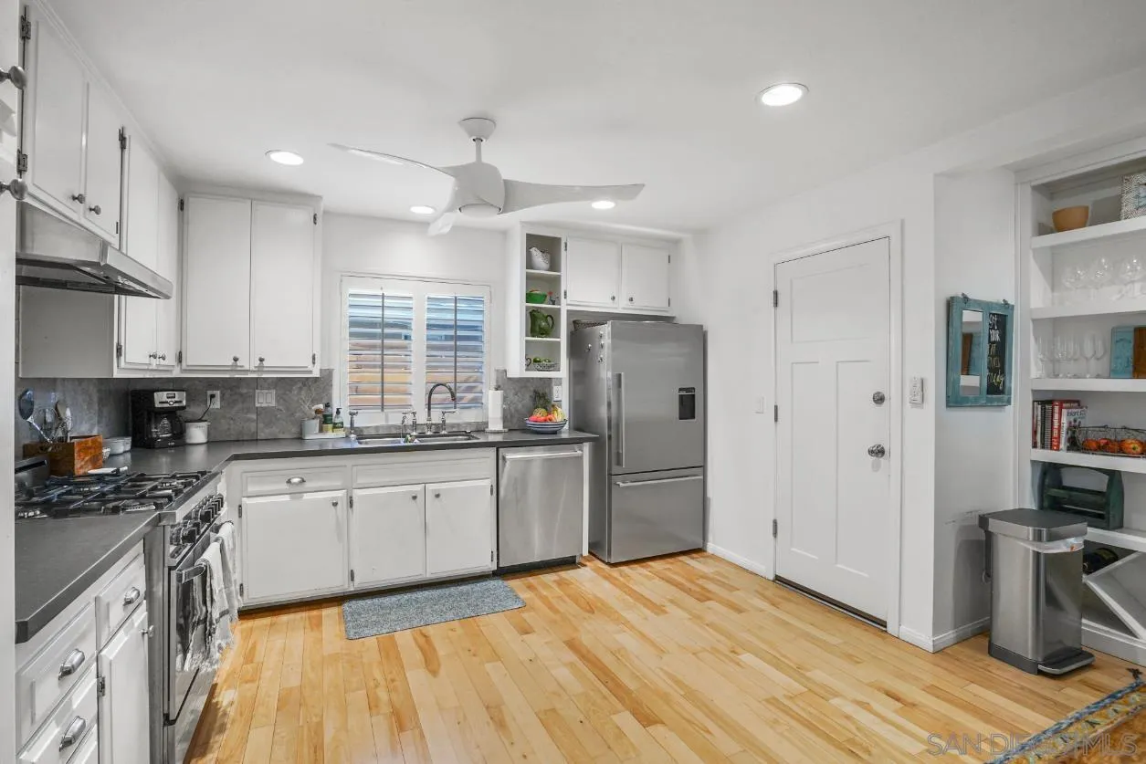 1161 Balour Drive Encinitas, CA 92024 - Photo 10 of 48 a kitchen with stainless steel appliances granite countertop a refrigerator sink and cabinets