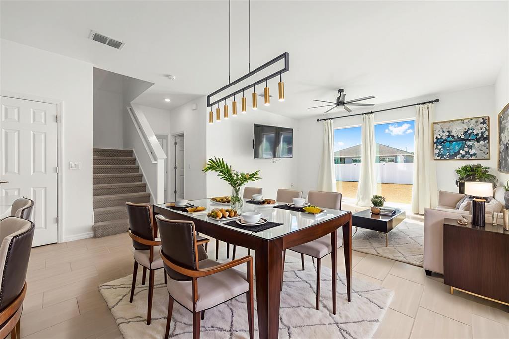 6366 Southwest 77th Avenue Ocala, FL 34474 - Photo 2 of 65 a view of a dining room with furniture window and wooden floor