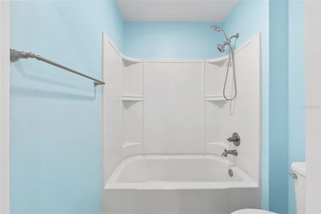 a bathroom with a double vanity sink mirror and shower