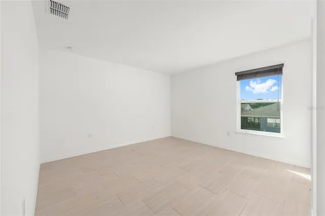 a bathroom with a double vanity sink a mirror and a shower