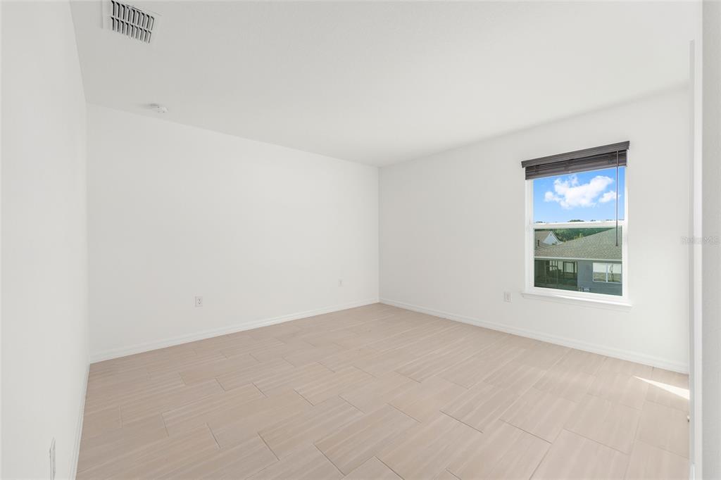 6366 Southwest 77th Avenue Ocala, FL 34474 - Photo 22 of 65 an empty room with a window