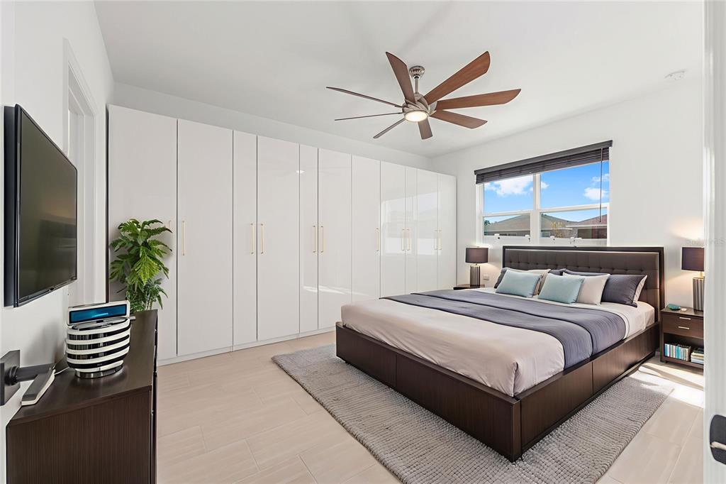 6366 Southwest 77th Avenue Ocala, FL 34474 - Photo 3 of 65 a bedroom with a bed and a chandelier