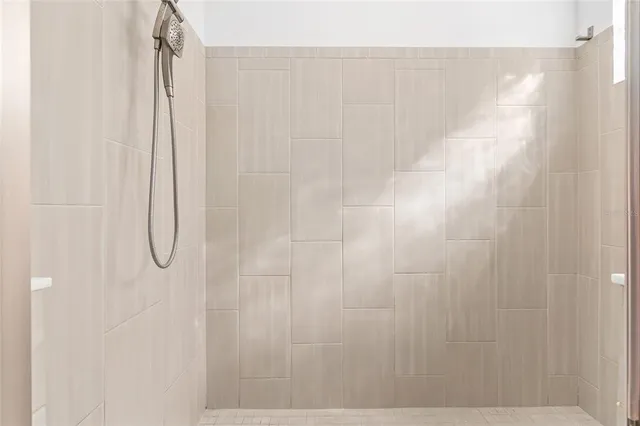a kitchen with a sink a counter space cabinets and appliances