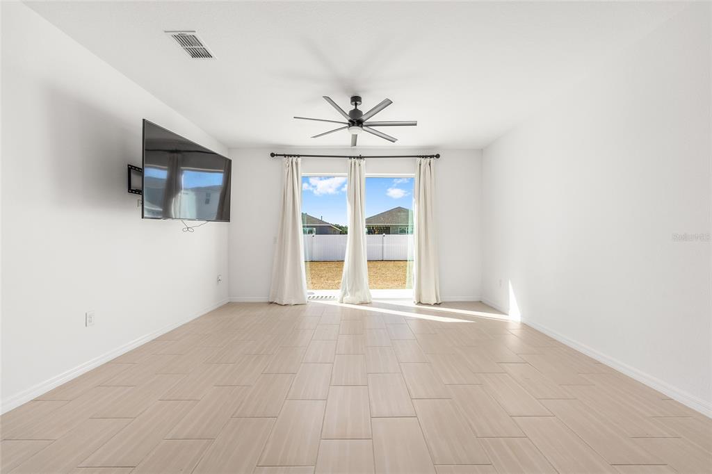 6366 Southwest 77th Avenue Ocala, FL 34474 - Photo 34 of 65 an empty room with windows and fireplace