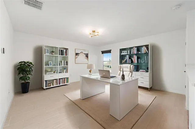 a living room with furniture and entryway