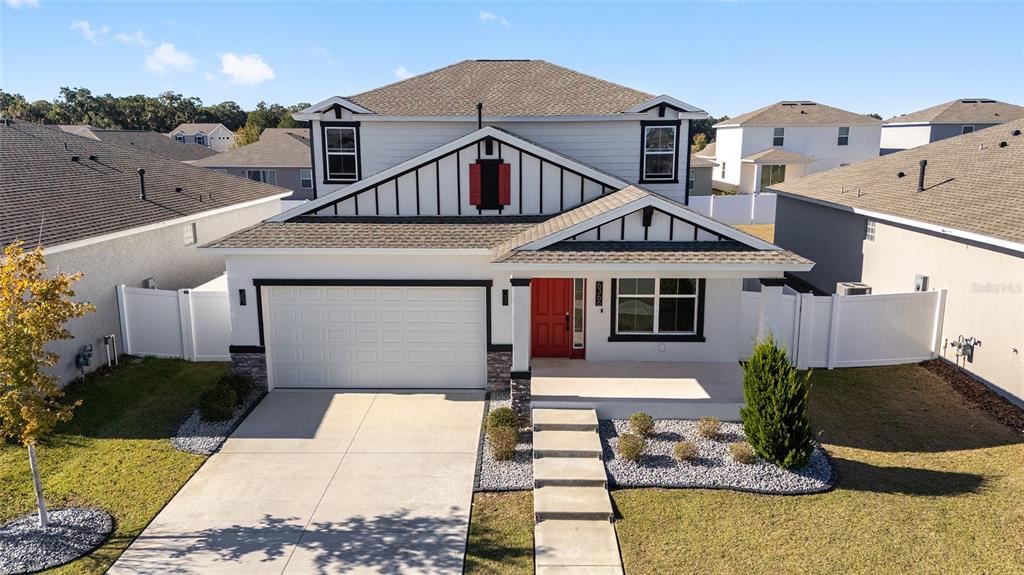 6366 Southwest 77th Avenue Ocala, FL 34474 - Photo 50 of 65 a front view of a house with garden