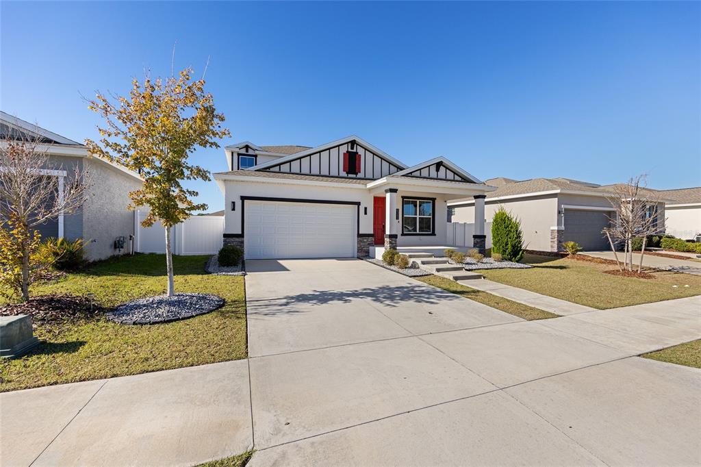 6366 Southwest 77th Avenue Ocala, FL 34474 - Photo 5 of 65 a front view of a house with entertaining space