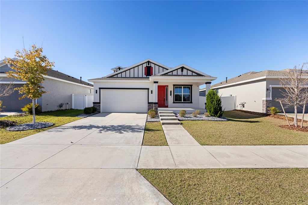 6366 Southwest 77th Avenue Ocala, FL 34474 - Photo 6 of 65 a view of a white house with a swimming pool