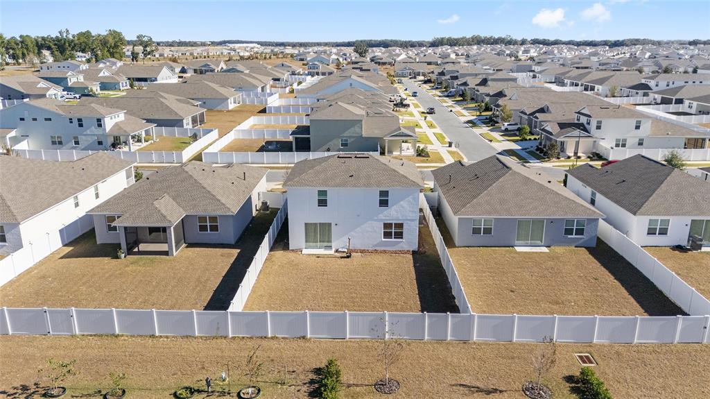 6366 Southwest 77th Avenue Ocala, FL 34474 - Photo 61 of 65 an aerial view of residential houses with outdoor space