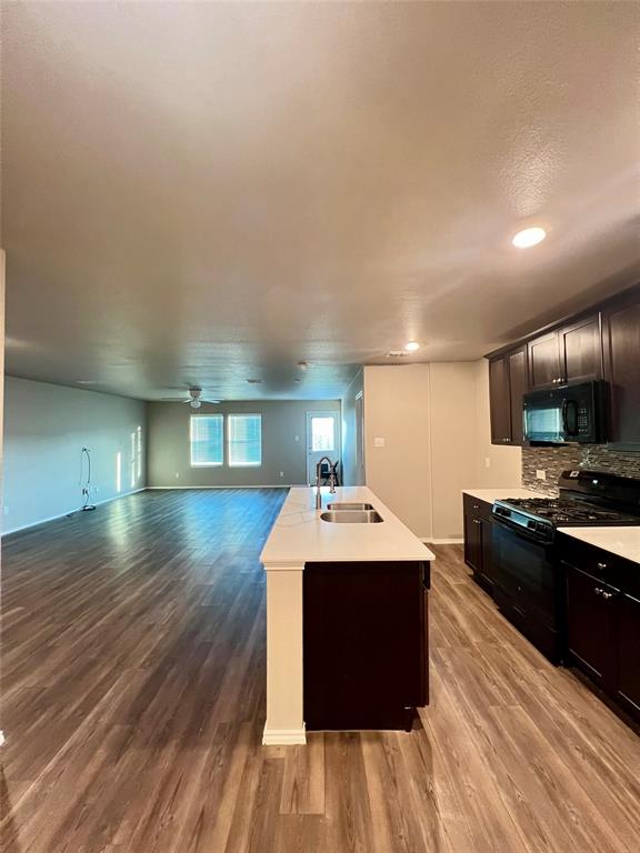 1515 Fields View Drive Anna, TX 75409 - Photo 3 of 16 a kitchen with a sink and a stove top oven