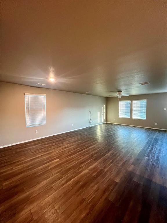 1515 Fields View Drive Anna, TX 75409 - Photo 4 of 16 a view of empty room with wooden floor and fan