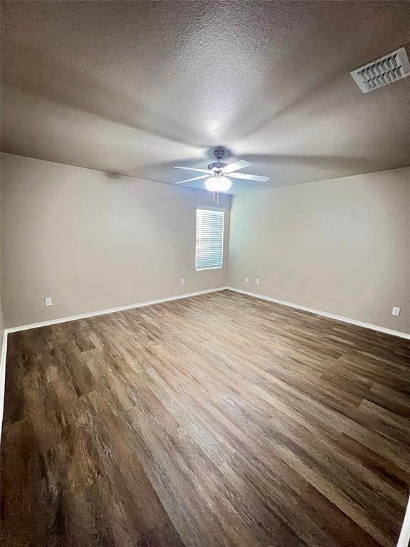 1515 Fields View Drive Anna, TX 75409 - Photo 7 of 16 an empty room with wooden floor and windows