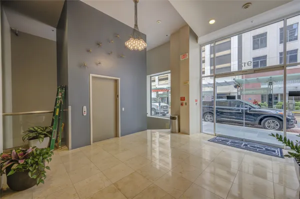 a kitchen with a table chairs stove and cabinets