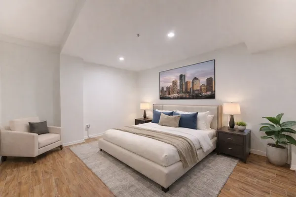 a view of a room with wooden floor