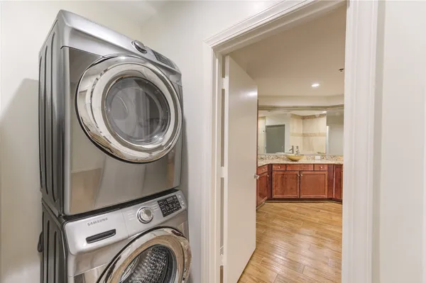 a bathroom with a granite countertop sink a toilet and a mirror