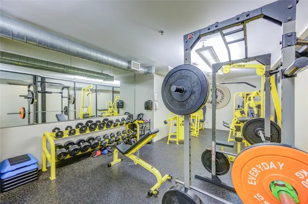 a view of a hallway with workspace and a window