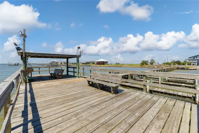 a view of a lake with houses in the back