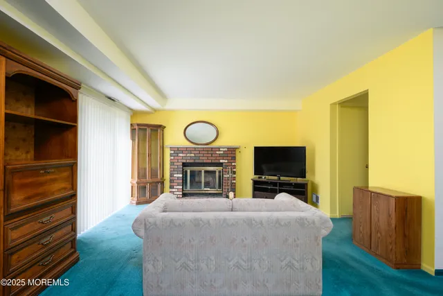 a view of living room with furniture and a flat screen tv
