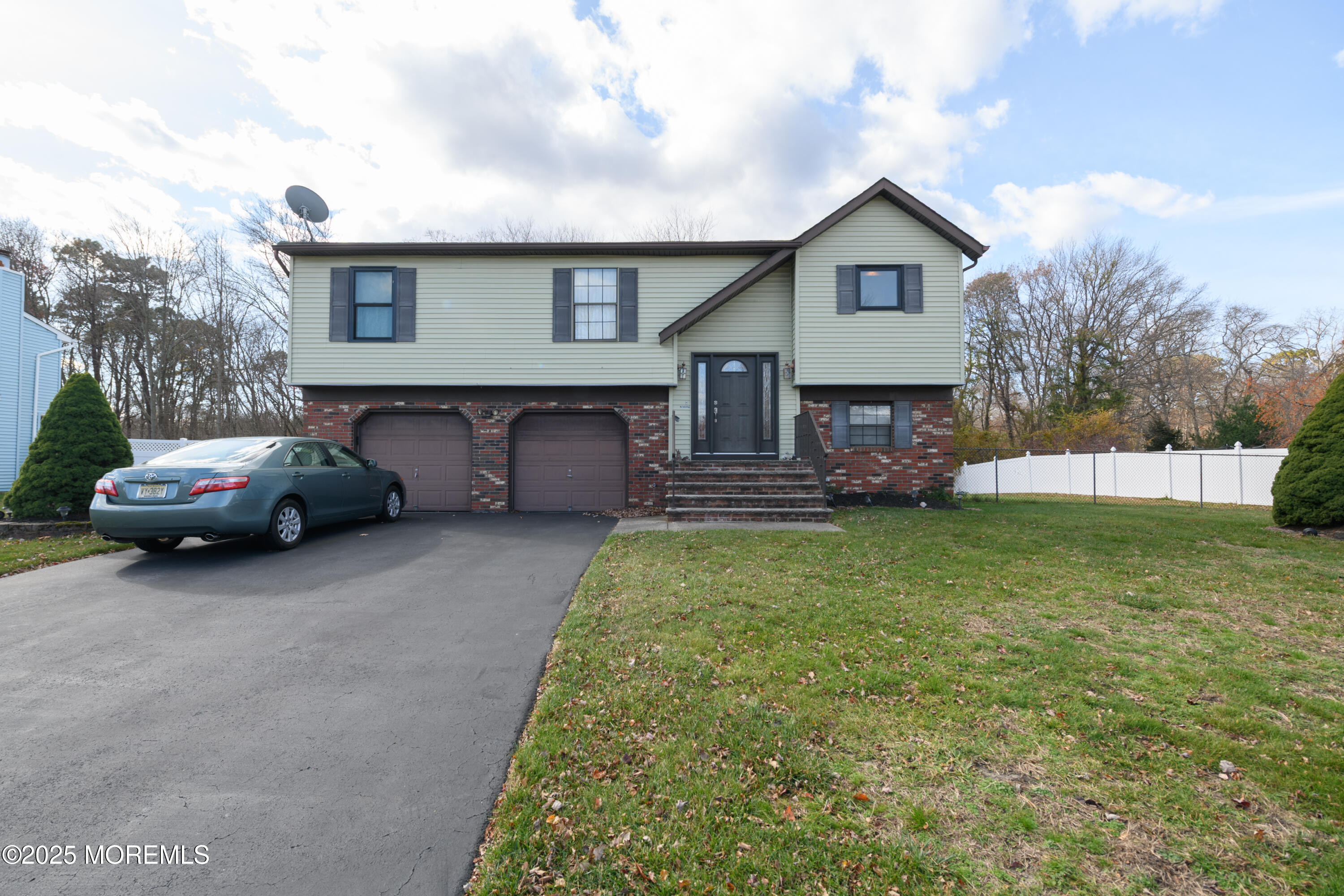 85 Starlight Road Howell, NJ 07731 - Photo 25 of 37 a view of a house with a yard and garage