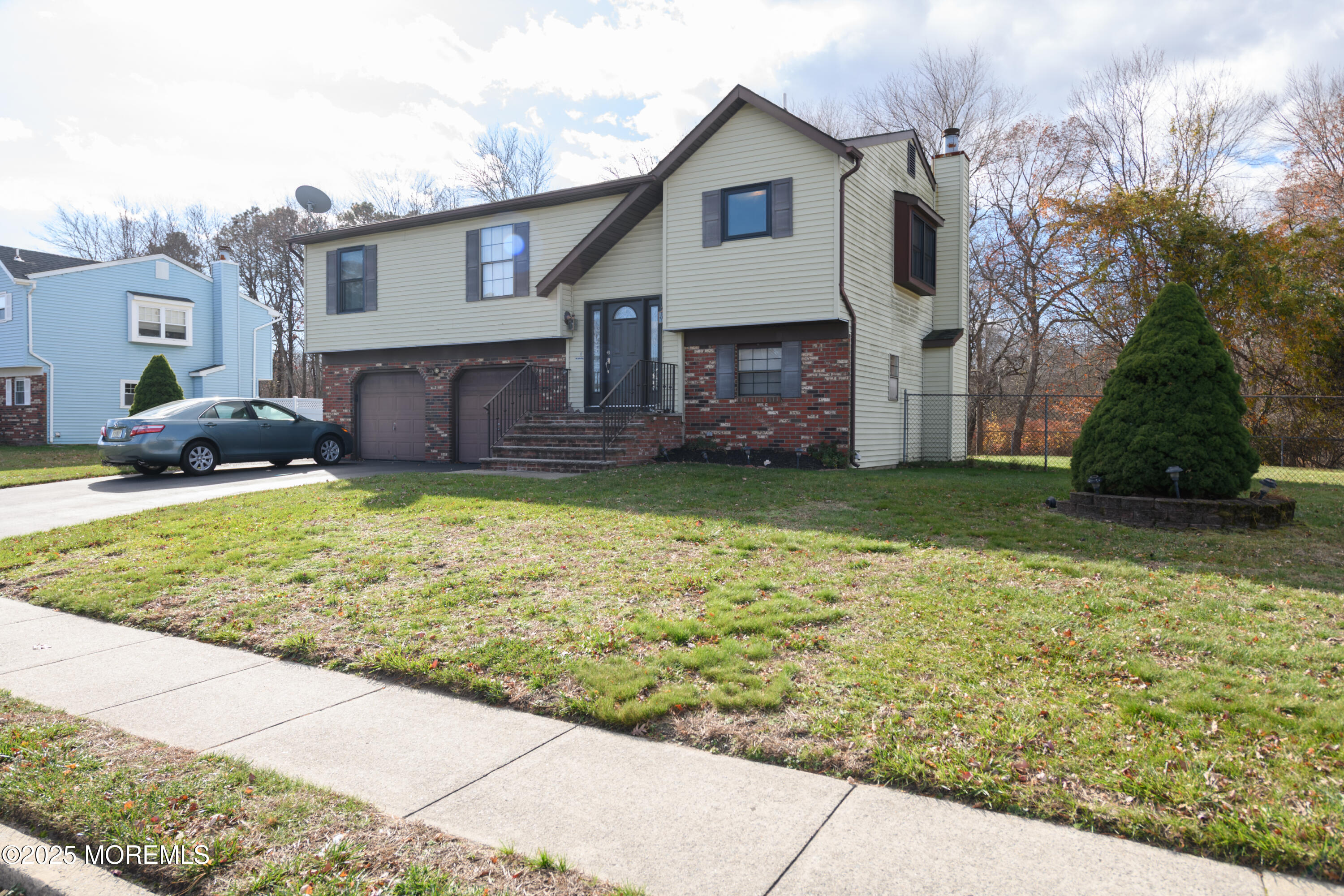 85 Starlight Road Howell, NJ 07731 - Photo 26 of 37 a view of a house with a patio and a yard