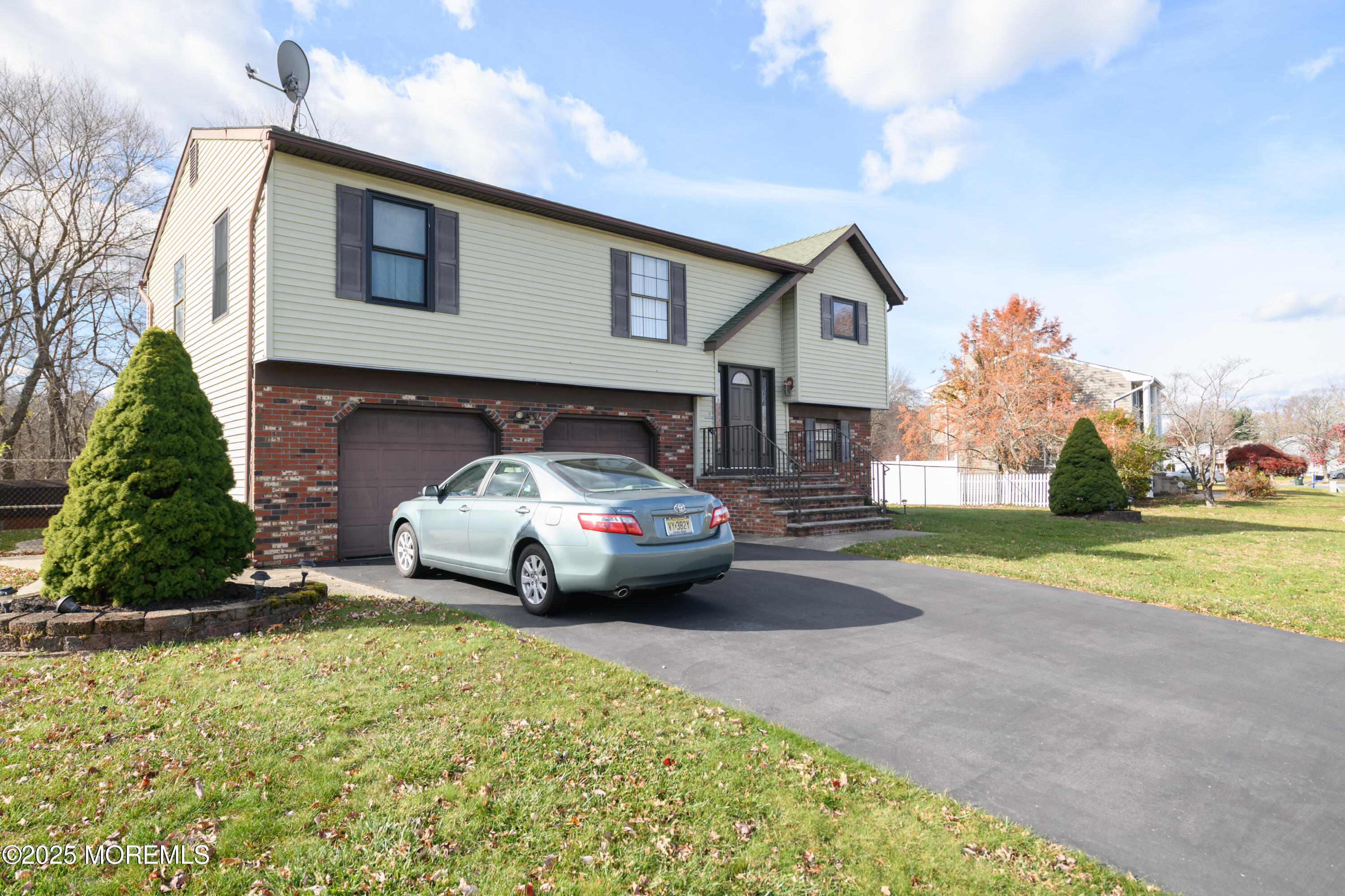 85 Starlight Road Howell, NJ 07731 - Photo 27 of 37 a front view of a house with a yard