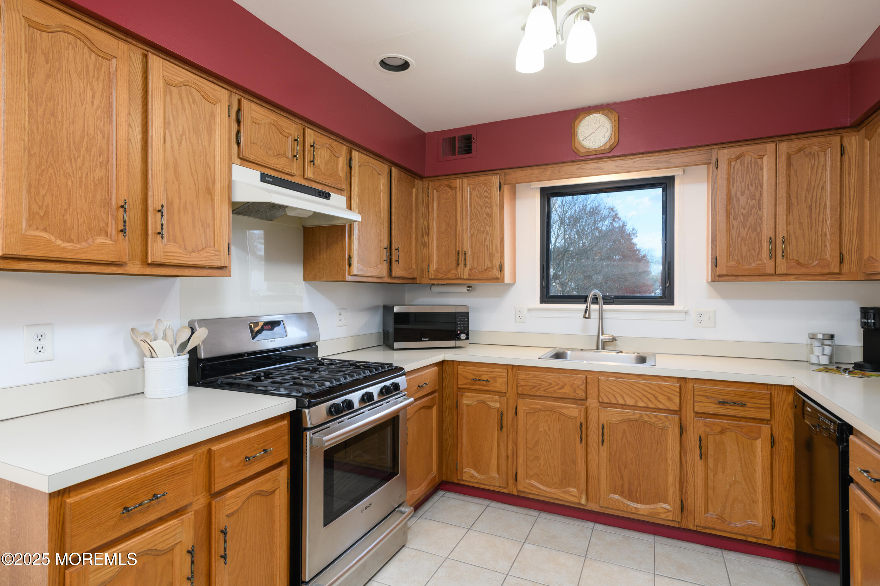 85 Starlight Road Howell, NJ 07731 - Photo 5 of 37 a kitchen with cabinets appliances a sink and a counter top space