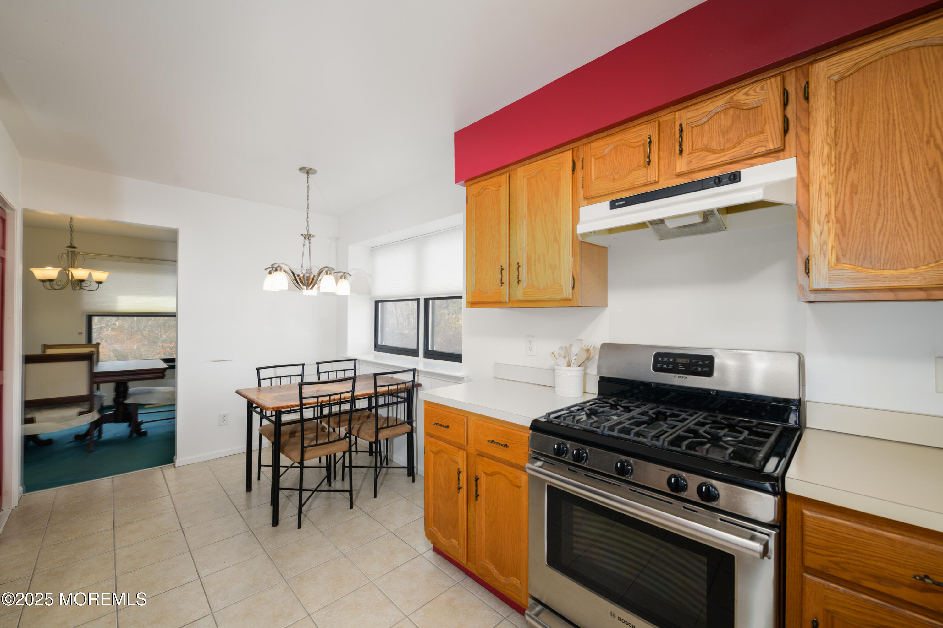 85 Starlight Road Howell, NJ 07731 - Photo 7 of 37 a kitchen with a stove a sink and chairs