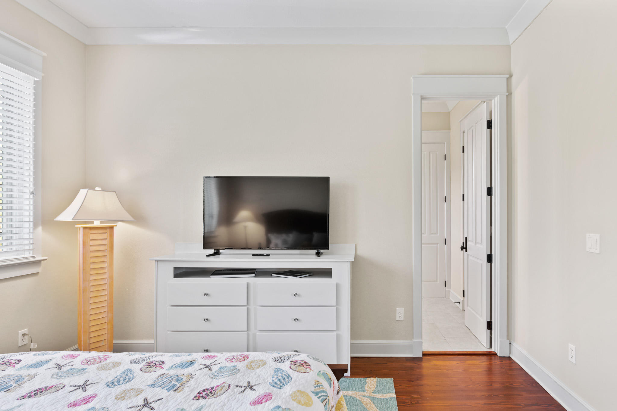 106 Okeechobee West Santa Rosa Beach, FL 32459 - Photo 30 of 53 a bedroom with a bed and a flat screen tv
