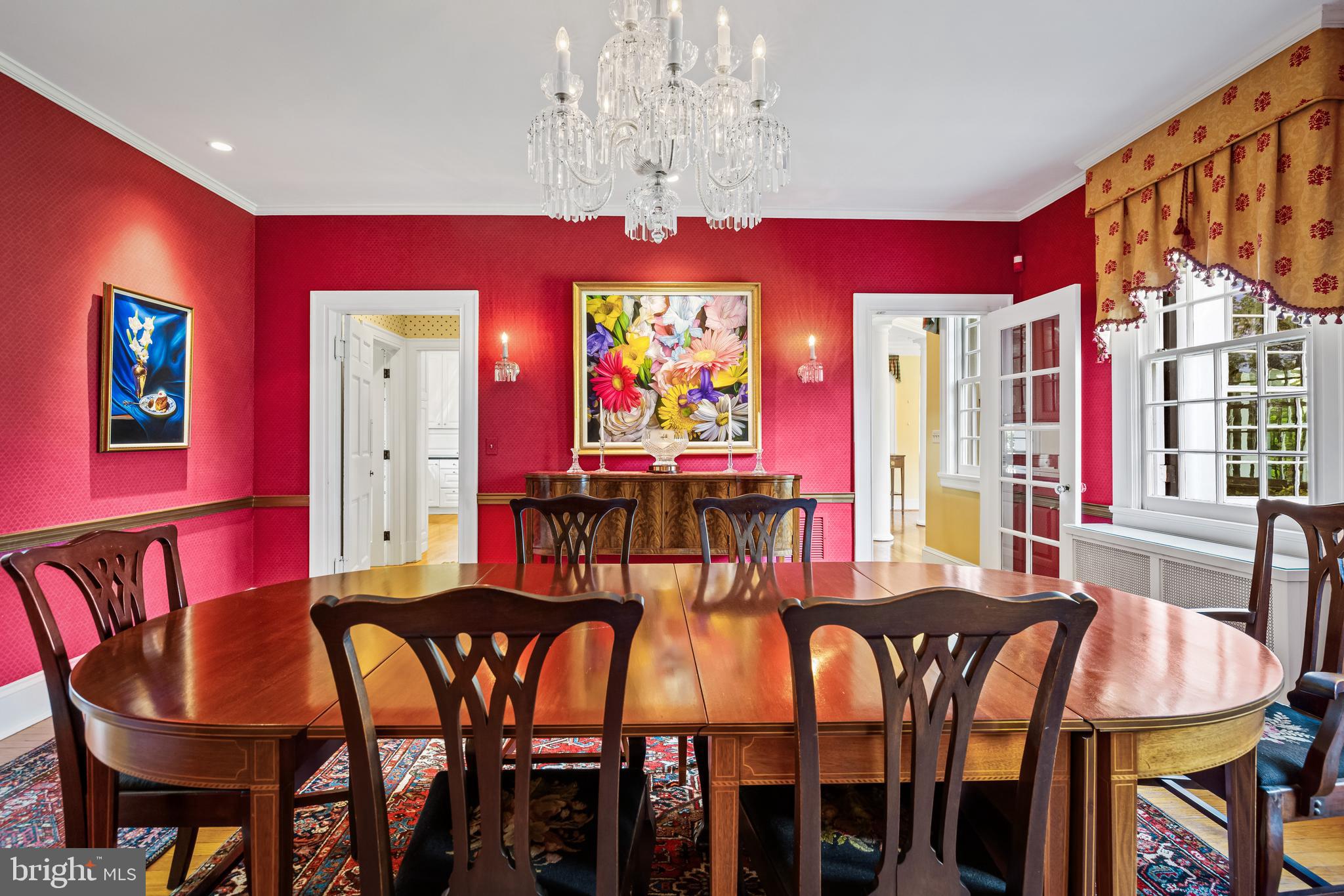 508 Hampton Lane Baltimore, MD 21286 - Photo 13 of 74 a view of a dining room with furniture a chandelier and wooden floor